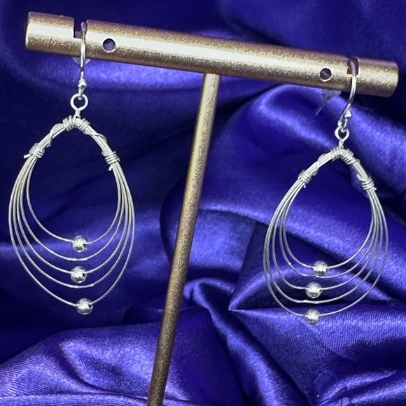 Multi Hoops with moving silver balls dangle earrings. - Picture 1 of 12